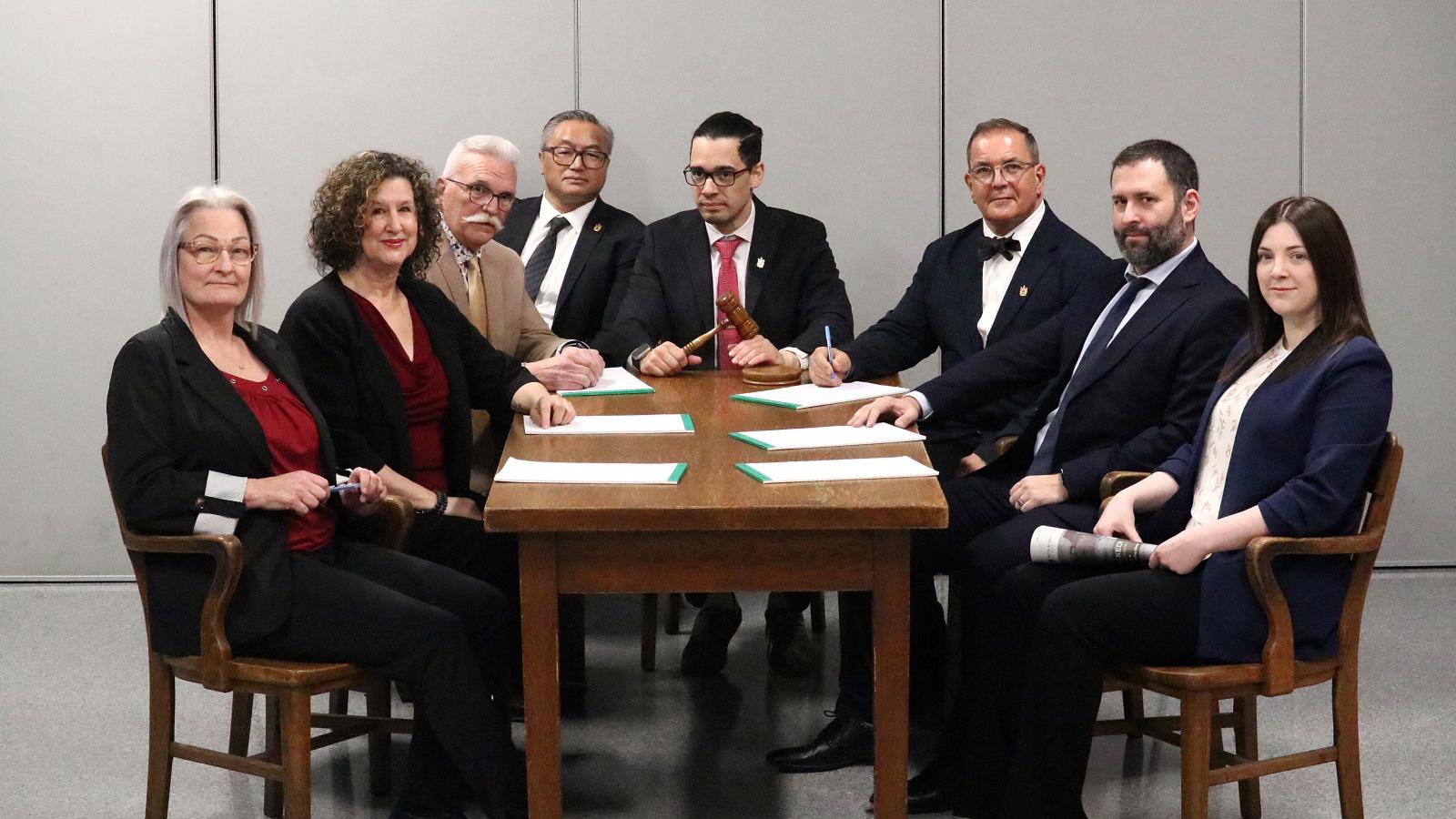 Current 2025 Council and Chief Administrative Officer sitting on the original 1955 Council table and chairs.
