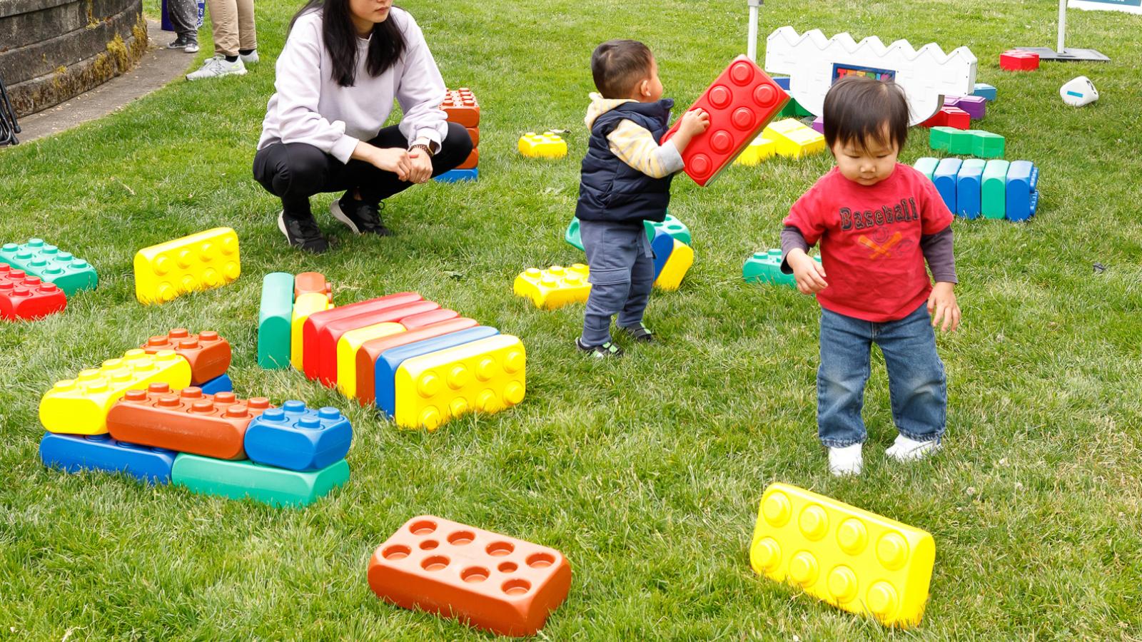 young kids playing with building blocks