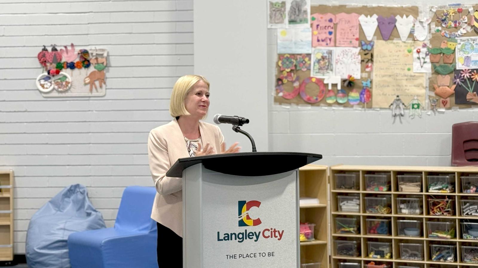 Lisa Beare, Minister of Education and Child Care speaking at the podium during the Douglas Recreation and Child Care Centre Grand Reopening