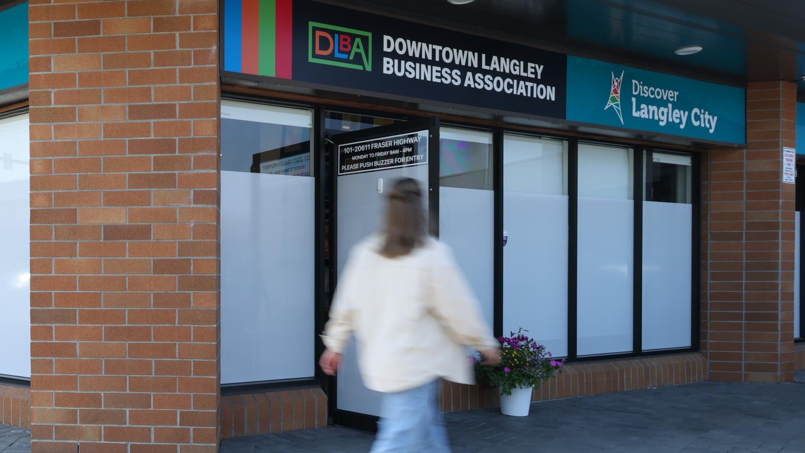 lady walking past Discover Langley office