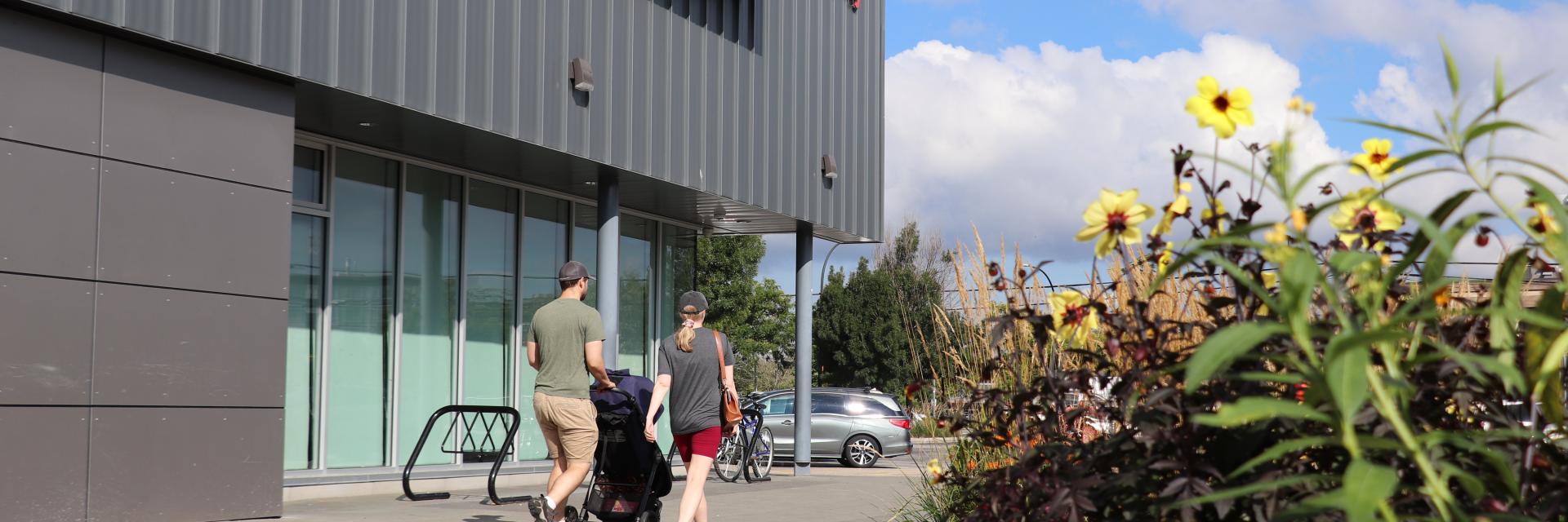 People walking outside at Timms Community Centre
