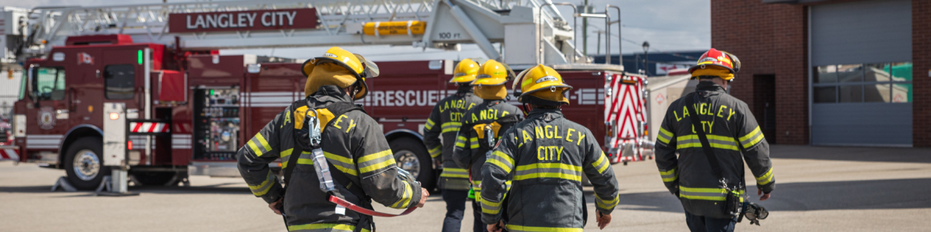 Langley City Fire Rescue Services firefighters walking towards fire truck