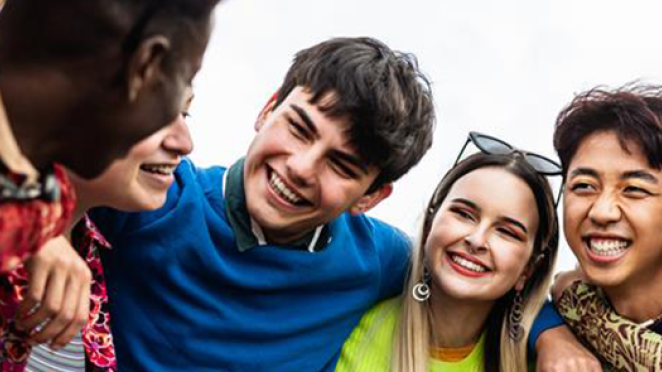 Group of diverse youth standing together.