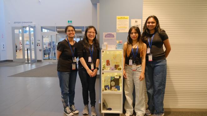 Teens setting up a art gallery display at Timms Community Centre