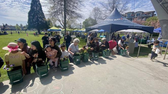 people planting seedlings at Earth Day