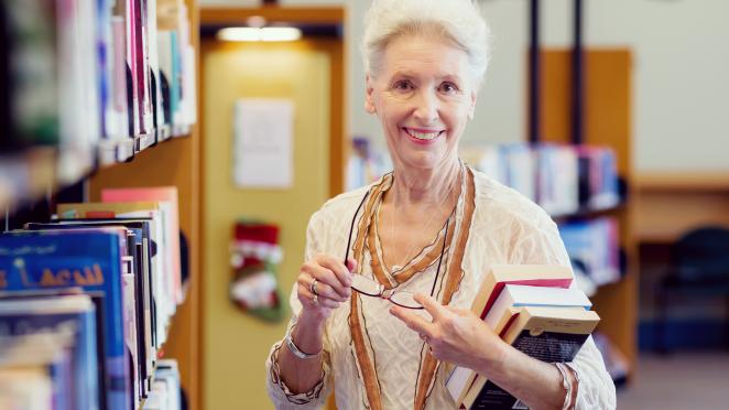 happy senior at the library