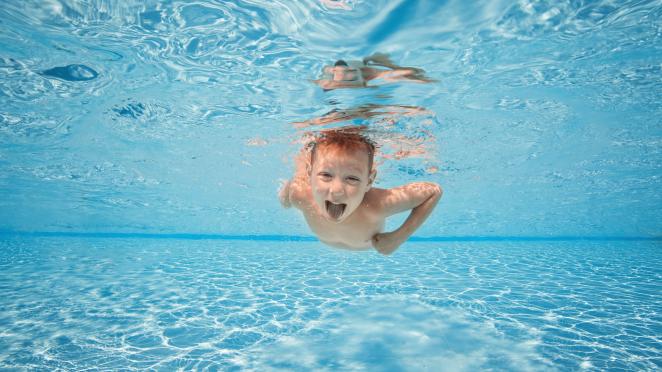 boy swimming underwater