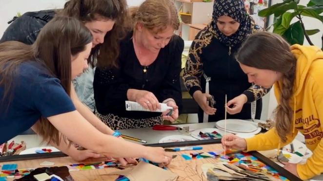 Group working on mural
