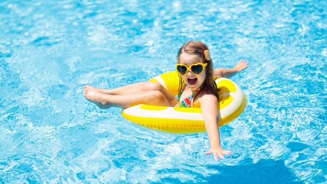 girl in floatie in pool