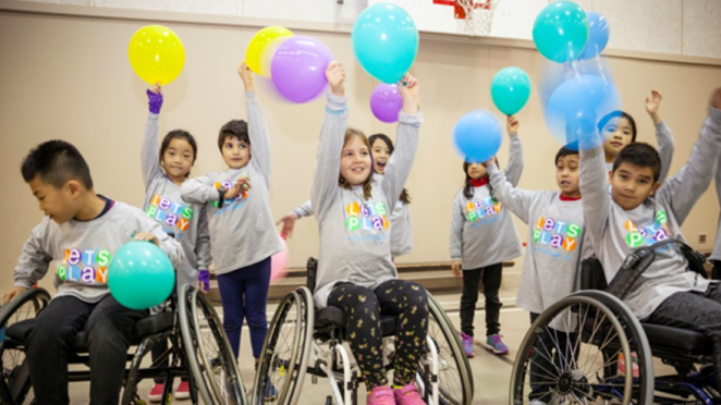 kids holding balloons