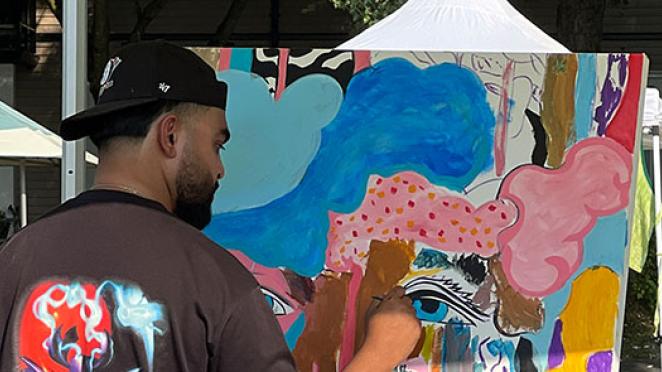 Man painting at park
