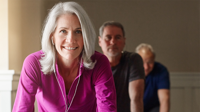 Senior woman on a spin bike